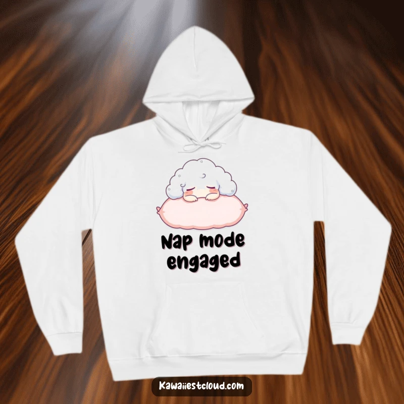 Funny hoodie featuring a content cloud character napping on a fluffy pillow, offering warmth and sleep-themed humor.