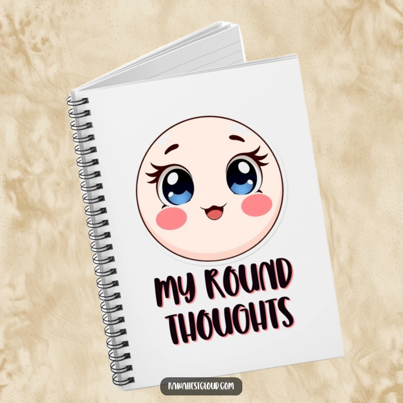 Funny notebook with a round, soft object featuring expressive eyes and rosy cheeks, perfect for jotting down cute ideas.